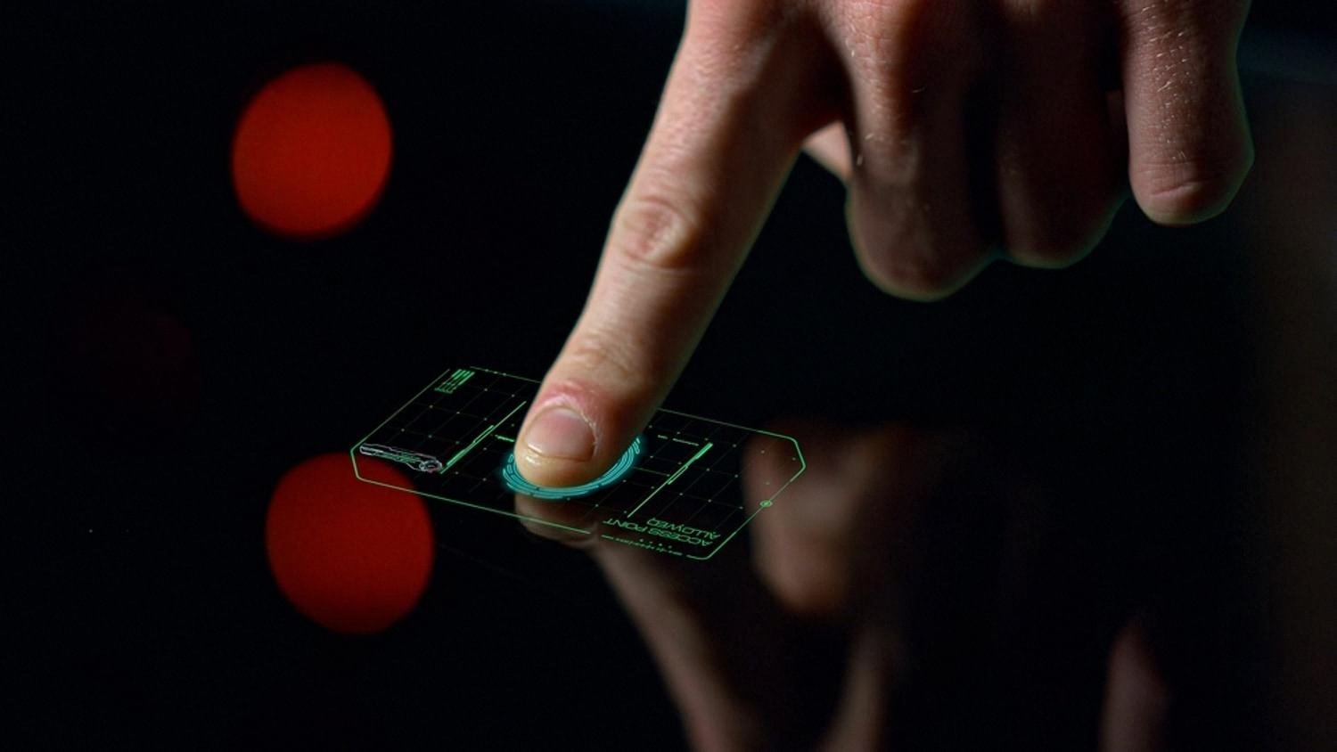 Fingerprint access point on a dark screen representing employee access control in a UAE company